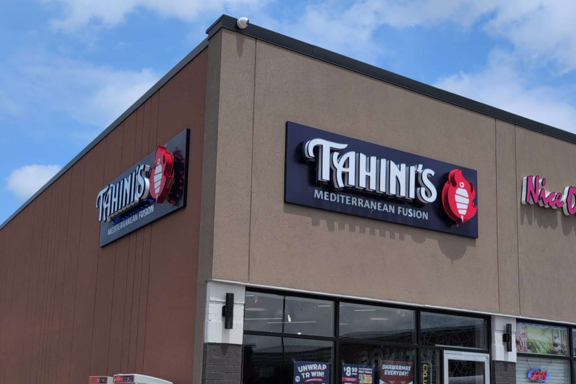 Exterior view of the Tahini’s Mediterranean Fusion restaurant in Woodbridge, Ontario, featuring the main signage and storefront window promoting fresh shawarma Woodbridge options.